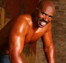 Steve Harvey smiling to distract you from how silly this photoshoot was