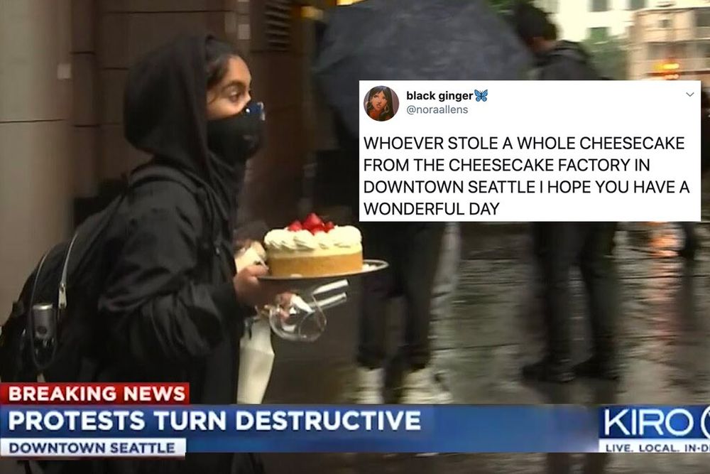 An image of a masked young woman holding a cheesecake topped with strawberries. A news chyron reads: BREAKING NEWS: PROTEST TURN DESTRUCTIVE - DOWNTOWN SEATTLE. A screen shot of a tweet from Black Ginger (@norallens) in the righthand corner reads: WHOEVER STOLE A WHOLE CHEESECAKE FROM THE CHEESECAKE FACTORY IN DOWNTOWN SEATTLE I HOPE YOU HAVE A WONDERFUL DAY