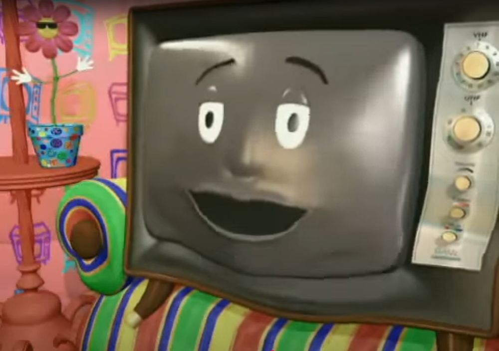 Image: A scene from the old Canadian PSA "Smart as you", featuring an anthropomorphic CRT Television telling the viewer how jealous they are that humans are smarter than him, animated in the finest CGI the 90s could offer