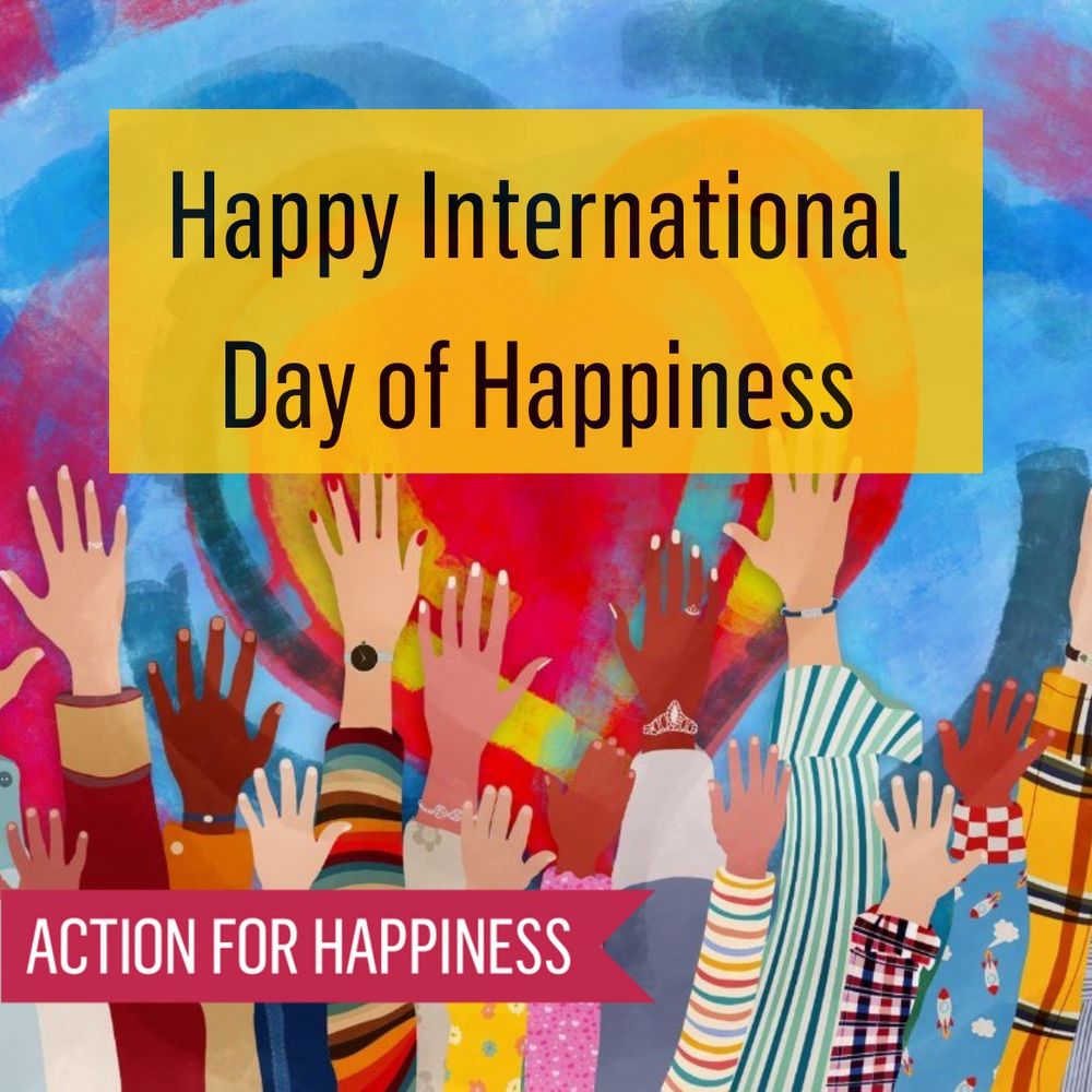 International day of happiness. Lots of hands waving in the air with colourful sleeves
