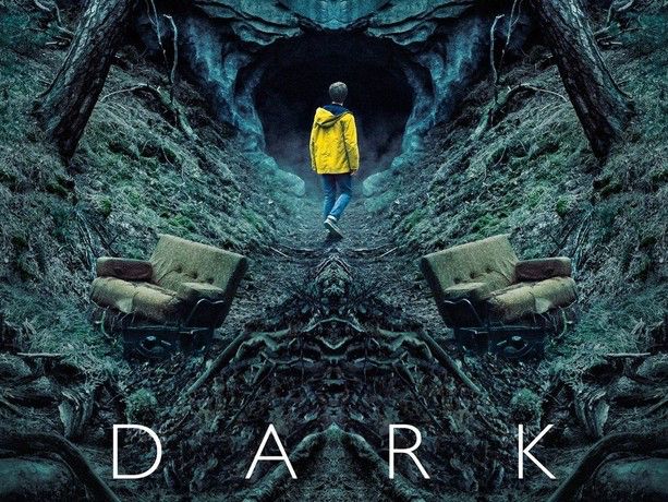 Picture from the series Dark, showing a young man in a yellow raincoat staring into a dark cave in a forest. 