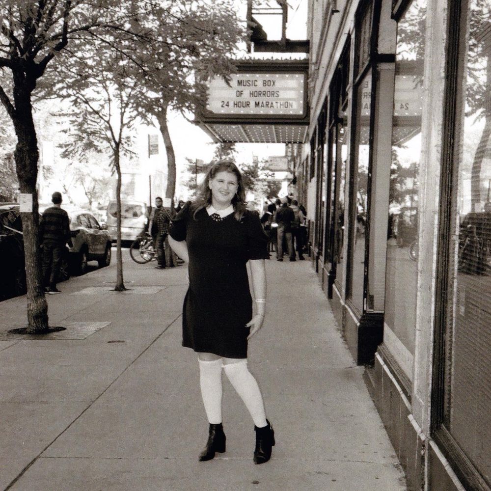 louise weard stands in front of the music box theatre circa 2022