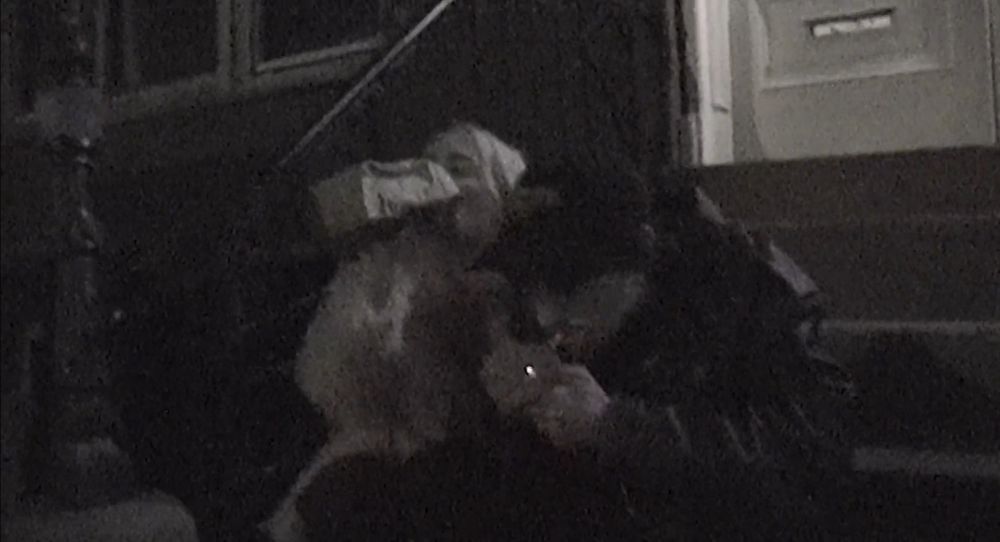 a couple smokes and drinks on a stoop