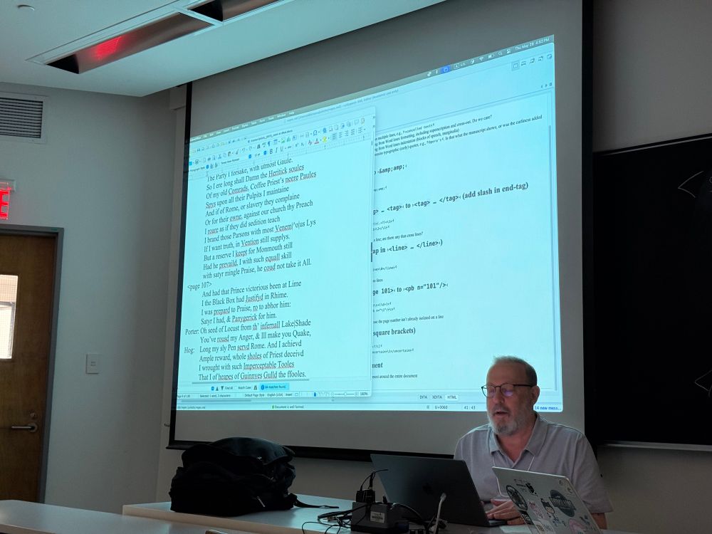 David Birnbaum working on a plan for auto tagging some complex transcription data with one of our students. 