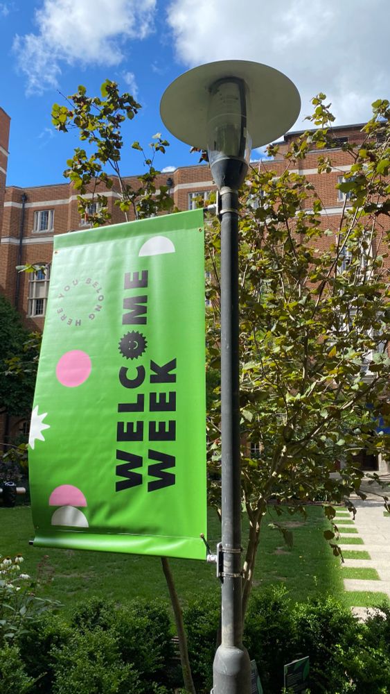 Banner with Welcome Week on and “you belong here” arranged in a small circle on the left