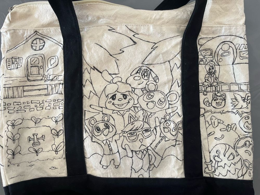 A tote bag with ink drawings in three panels: 1. An overhead view of a farm in the style of Stardew Valley. 2. A group of characters from Animal Crossing stand on a small island. 3. A scene from Slime Rancher showing Beatrix LeBeau sitting on a porch overseeing a corral full of a variety of slimes.