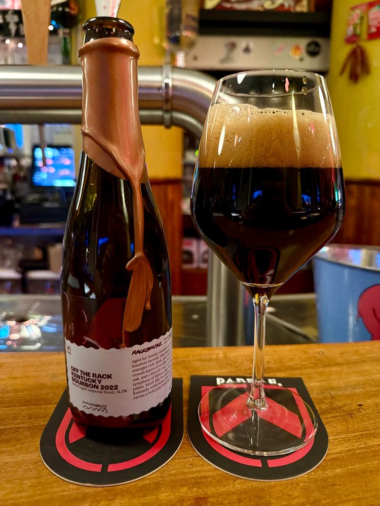 Picture showing a bottle of Lervig “Off the rack Kentucky Bourbon 2022” beer, poured into a glass