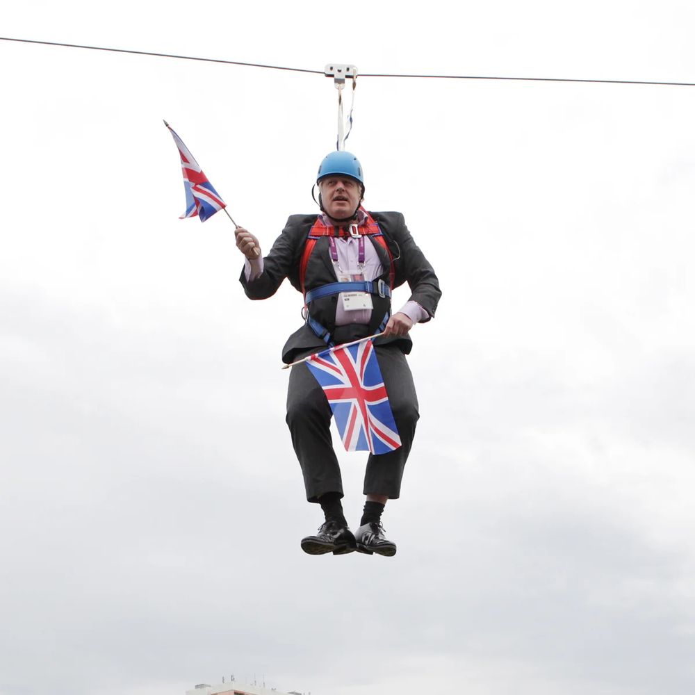 Boris Johnson stranded on a zip wire waving union jack flags
