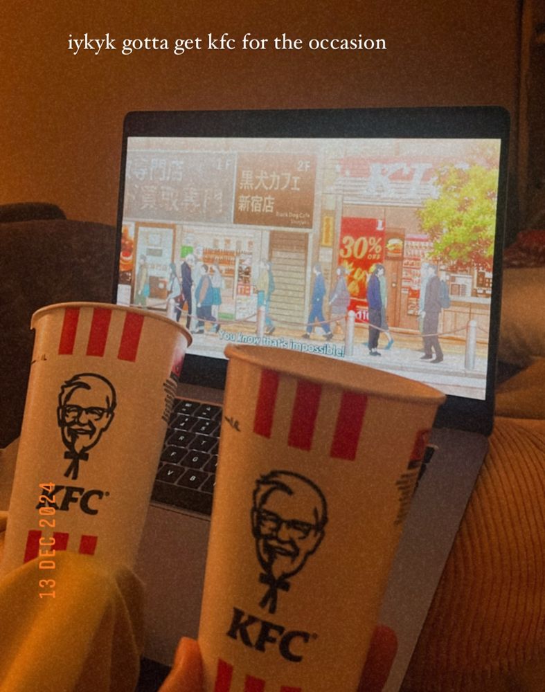 two kfc cups in front of the kfc scene in jjk