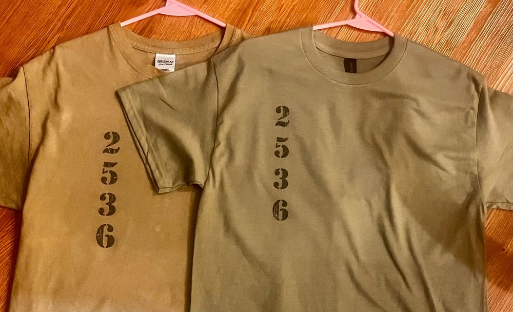  A pair of greenish-grey size L T-shirts with the number "2536" printed along the right side. 