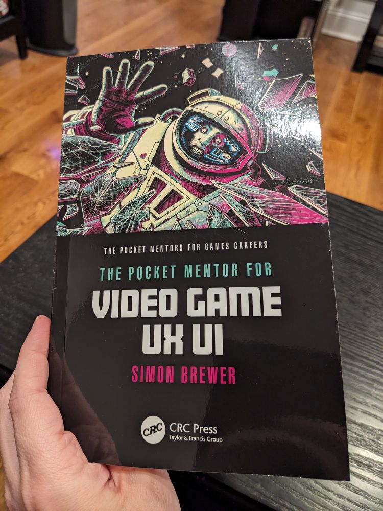 The cover of The Pocket Mentor for Video Game UX UI, by Simon Brewer