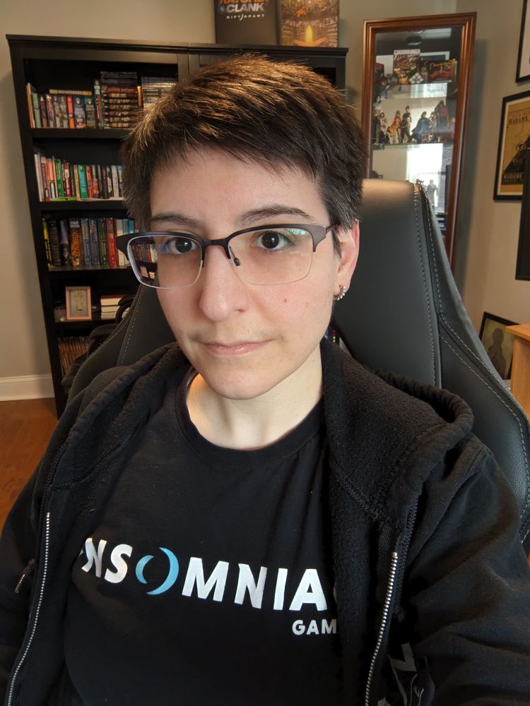 I have short dark, graying hair, brown eyes and glasses. I'm wearing an Insomniac t shirt and a black hoodie.