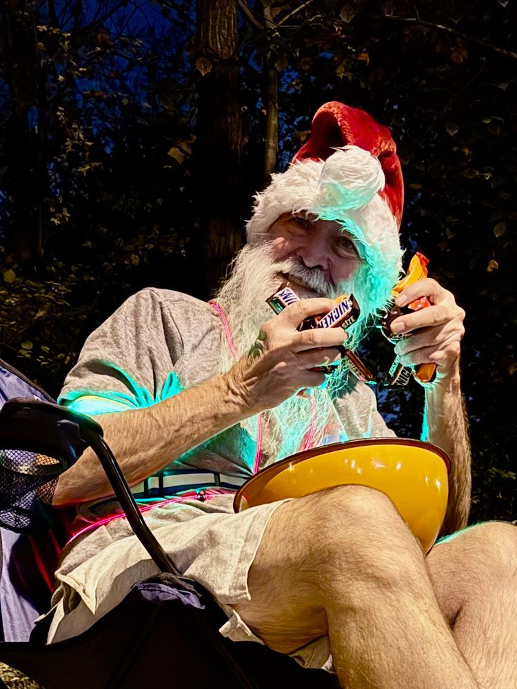 "Santa" preparing to distribute Halloween candy to the local kids