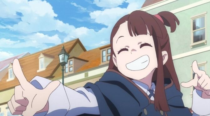 Akko from Little Witch Academia, she's smiling and pulling a pose pointing her fingers. 