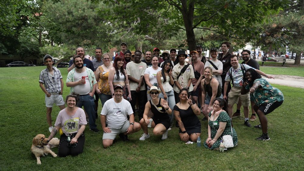 A group photo featuring nerds touching grass  