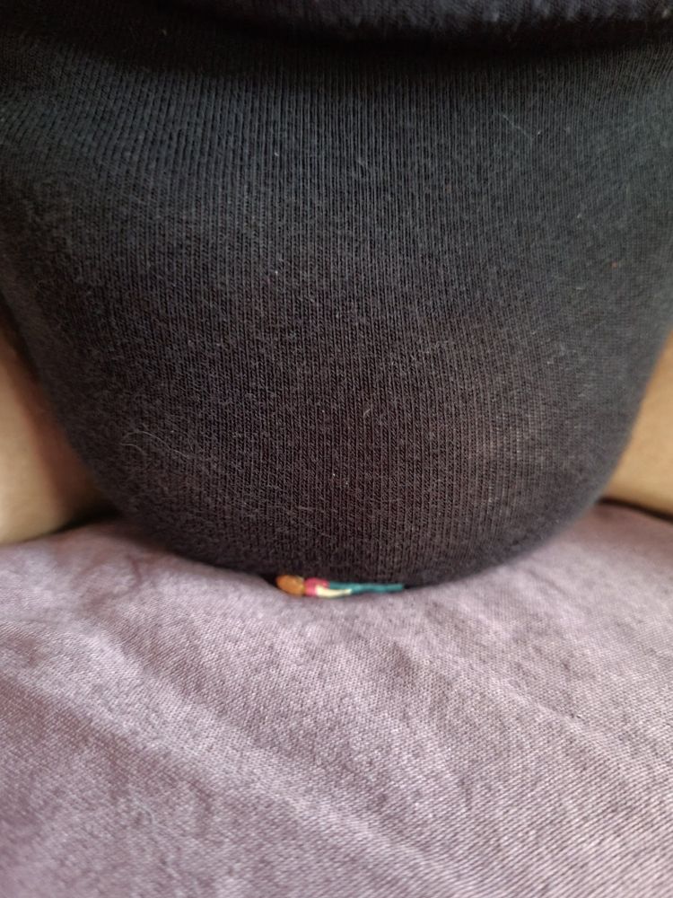 a very tiny woman on her back is getting smothered under another woman's bulge (black underwear). it's hard to tell because her face is under my balls and also because she's made of plastic but she's having a good time.