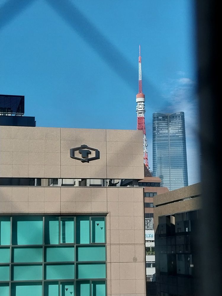 tiny bit of Tokyo Tower showing from a hotel window