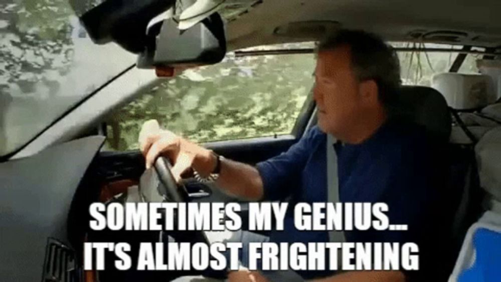 a man is driving a car and saying sometimes my genius it 's almost frightening