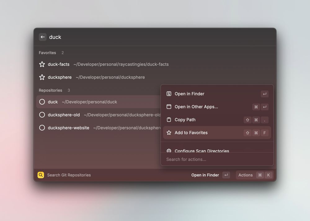 Dark-themed Mac Raycast window with the search term “duck” at the top. Below it, a “Favorites” section lists two starred folders (`duck-facts` and `ducksphere`) with their `~/Developer/personal/...` paths, and a “Repositories” section lists three entries (`duck`, `ducksphere-old`, `ducksphere-website`) each pointing to `~/Developer/personal/...`. The `duck` entry is selected, and a translucent context menu floats over it showing actions: “Open in Finder,” “Open in Other Apps…,” “Copy Path,” “Add to Favorites,” and “Configure Scan Directories.” At the bottom is a search field labeled “Search Git Repositories” with buttons “Open in Finder” and “Actions.”
