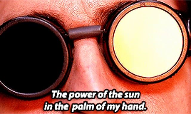 a man wearing goggles says the power of the sun in the palm of his hand