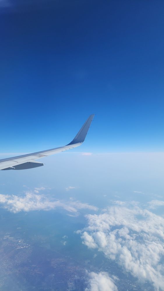 View from an airline window of the sky.
