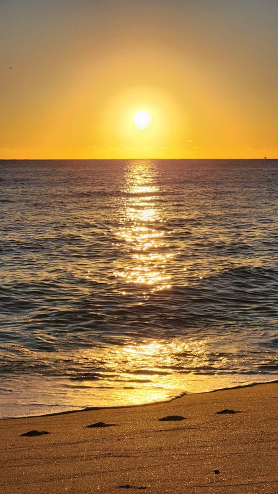 Sun rising over the Atlantic Ocean. Photo taken in Sunny Isles Beach, Florida.