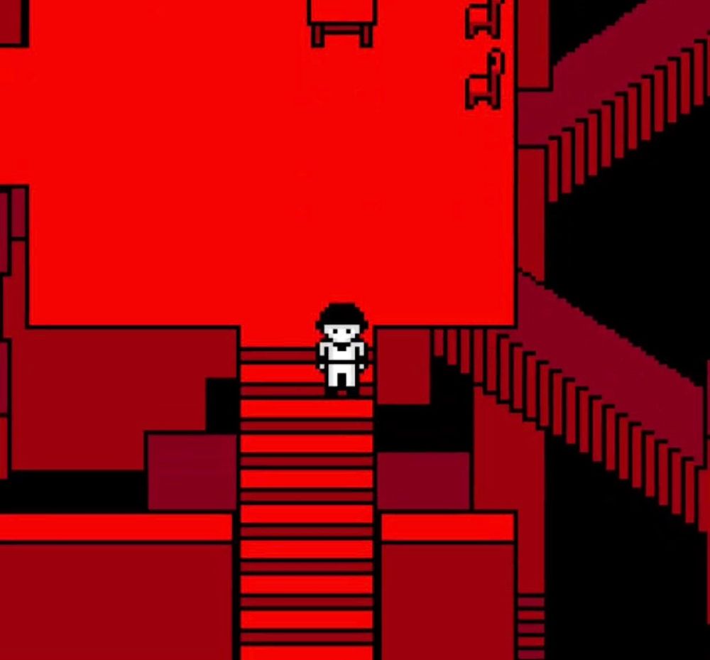 A screen shot of a pixel game. Everything is red except for The Batter standing on a staircase in the middle. There's other staircases and walls twisting around him.