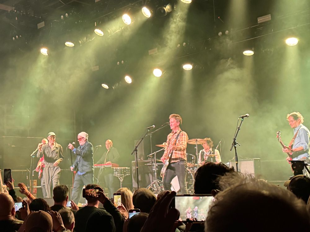 A stage full of musicians performing. 