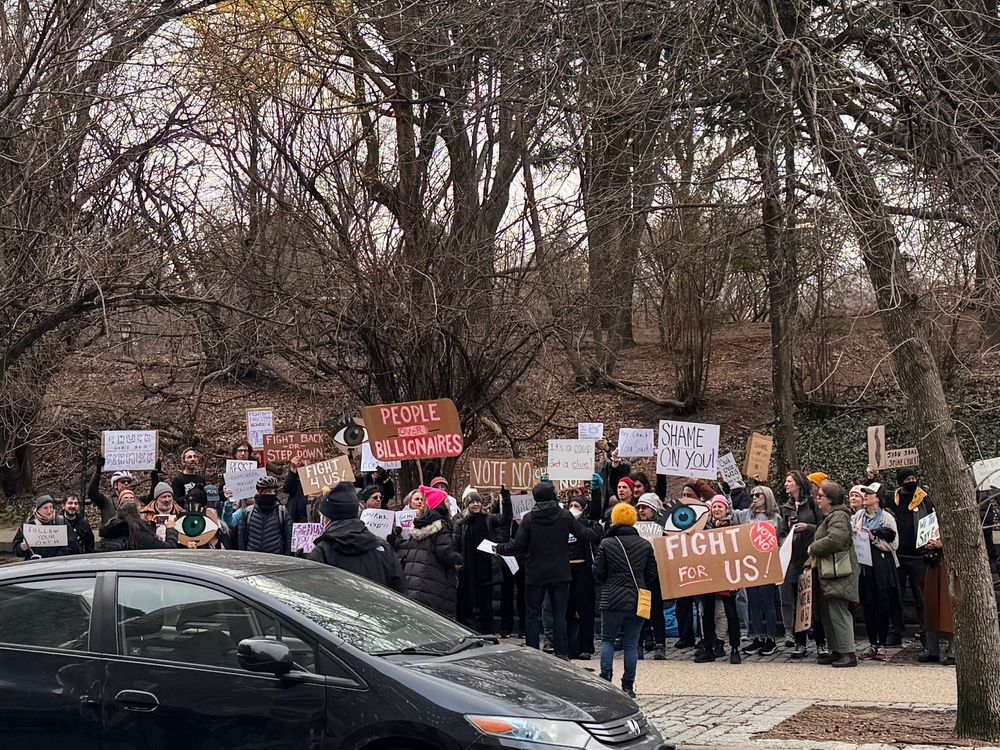 Protesters holding signs. 