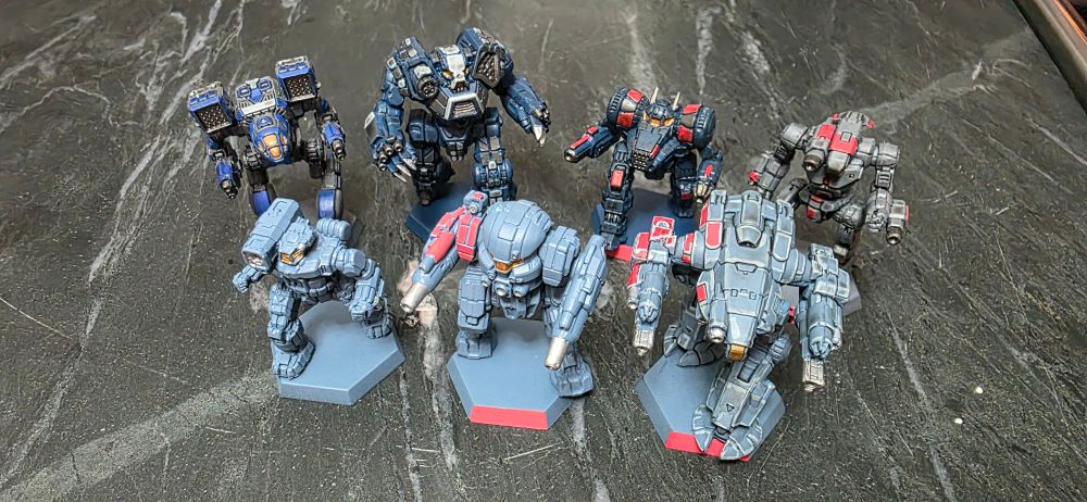 Various battletech battlemechs arrayed showing Ghost Bear and Rasalhague paint schemes with variations on blues, whites, and reds.