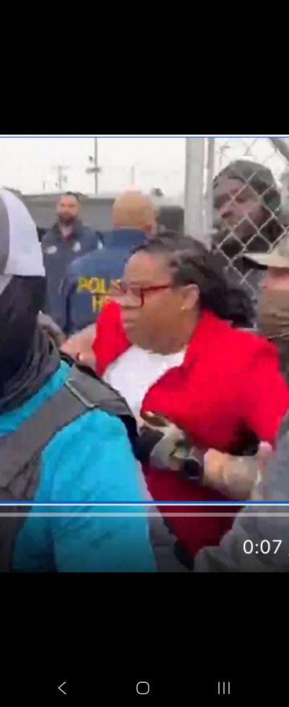 Ice guy has his hand on her breast. He is assaulting her