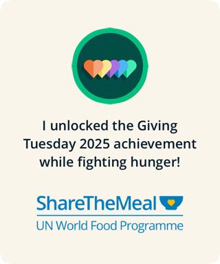 A notification from the UN World Food Programme Share The Meal app stating “I unlocked the Giving Tuesday 2025 achievement while fighting hunger!” The picture features a green circle with overlapping multicoloured hearts inside, the above mentioned text and the ShareTheMeal app logo (a blue bowl with a small yellow heart in the center.) 