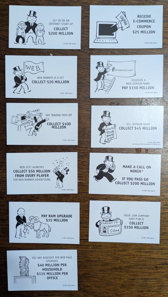 A selection of cards from the Monopoly deck, including references to bubble classics like going public, buying/selling a web domain, day trading, banner advertising, and "Make a call on Nokia."