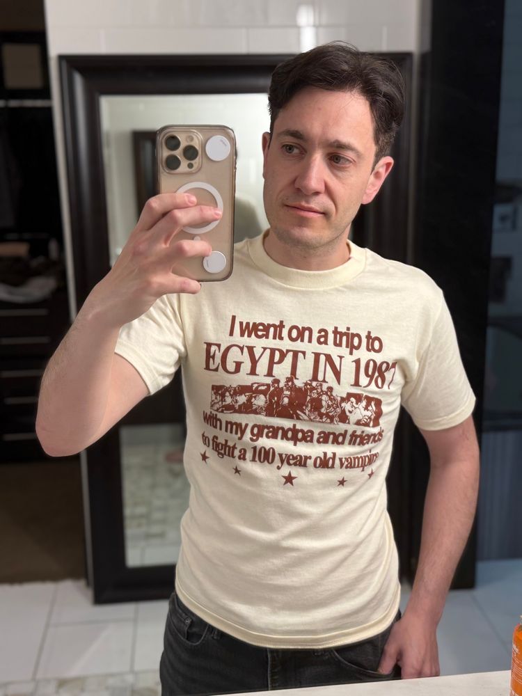 Ed wearing a shirt that says "I went on a trip to
EGYPT IN 1982
With my grandpa and friends to fight a 100 year old vampire"