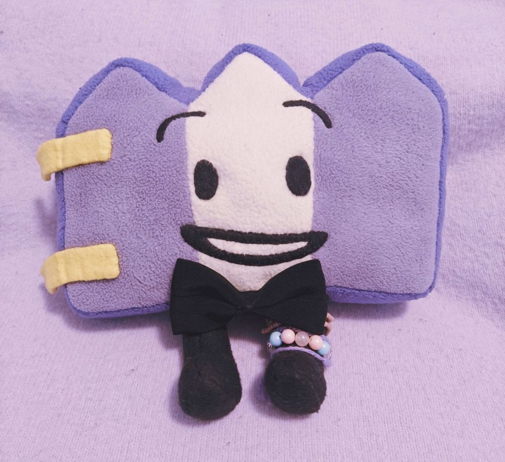 Gaty plush wearing a bowtie.