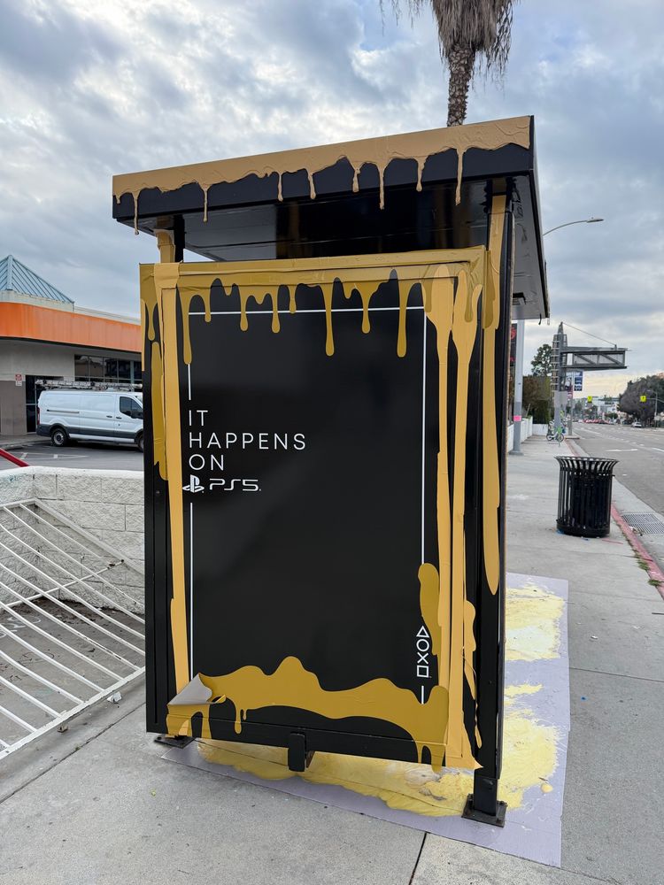 A bus stop advertisement for PS5. Either Winnie the Pooh was here or some other debauchery is afoot.