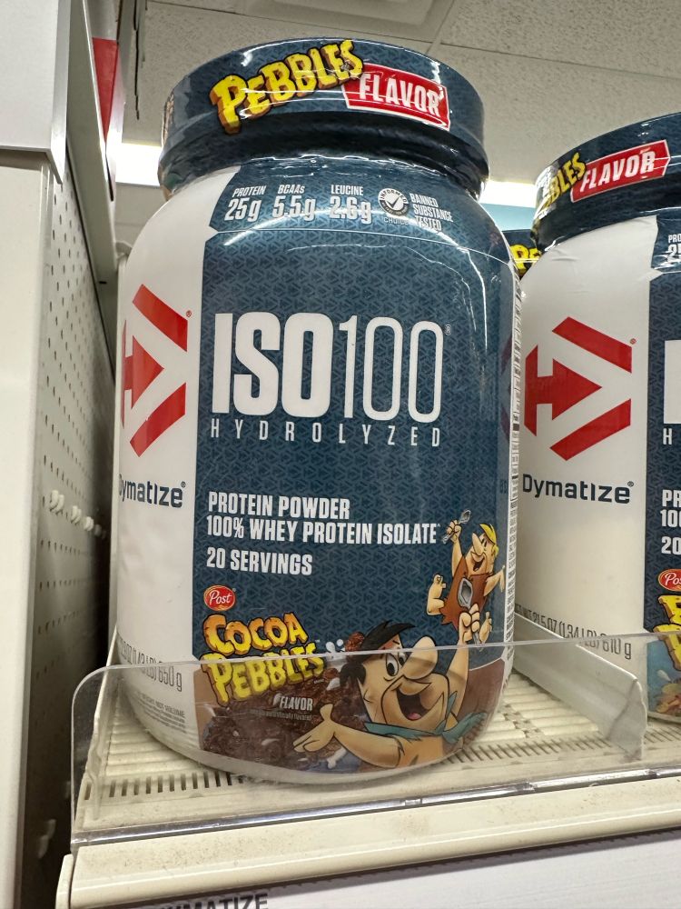 A shelf with a 20-serving container of Flintstone’s Cocoa Pebbles-flavored ISO100 Hydrolyzed whey protein powder 