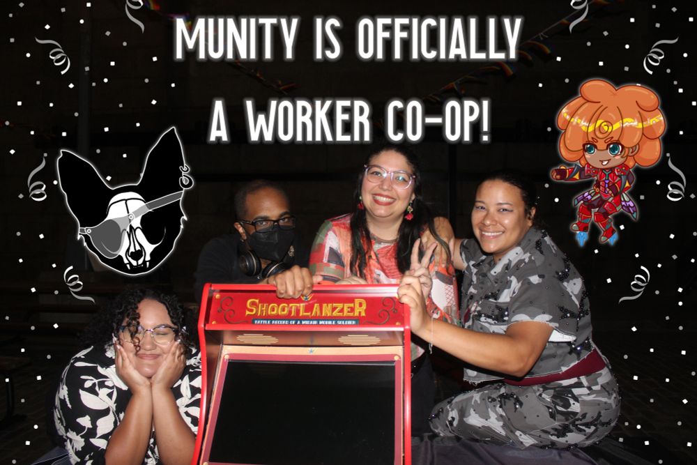 An image of 4 of the original 5 co-founders of Munity around the Shootlanzer mini arcade cabinet, Ladybug Mk. 1. Above is a caption that reads "Munity is officially a worker co-op!" White and gray confetti is falling around the edges. Mew, Munity's pirate cat mascot, is on the left and a chibi version of Leona, the main character of Shootlanzer, appears on the right.