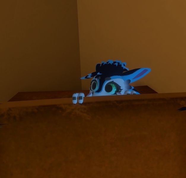 An avali peeking out of the cardboard box