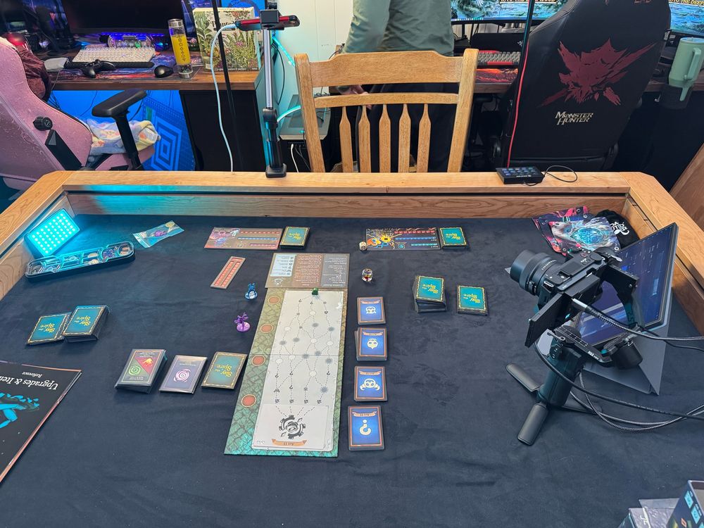 Picture of a board game table with slay the spire on it 