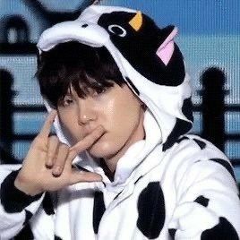 Yoongi in a cow onesie and an i love you in sign language pressed against his lips like he's a romantic gangster. The cow onesie is nomming his head. I freaking can't. He's so cute. 