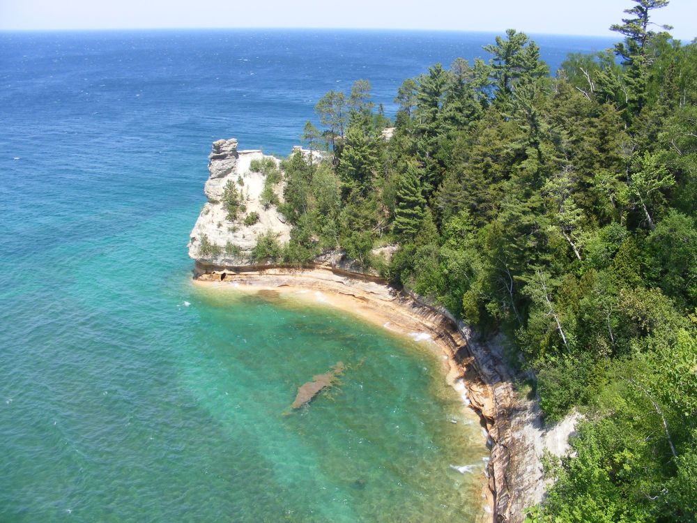 Miners Castle is made up of white Munising Sandstone over red Jacobsville Sandstone. The former is from a shoreline environment in the Cambrian Period (487-520 mya). The latter is from a river environment in the Tonian (980-1010 mya). Pictured Rocks National Lakeshore, Michigan, 24 May 2012.