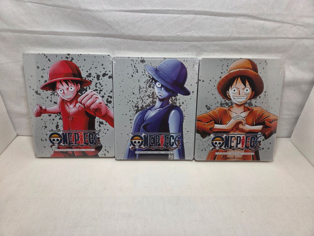 Photo des 3 boîtiers BluRay contenant les 11 premiers films de "One Piece"