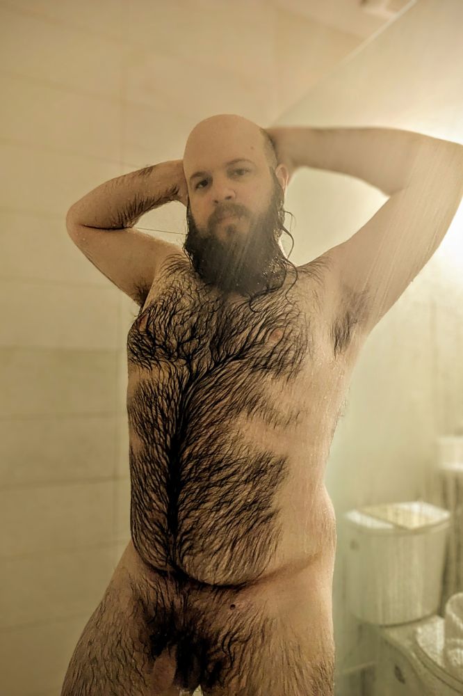 Photo of me in the shower with my hands behind my head