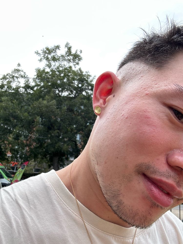 Right earring, gold oval shape