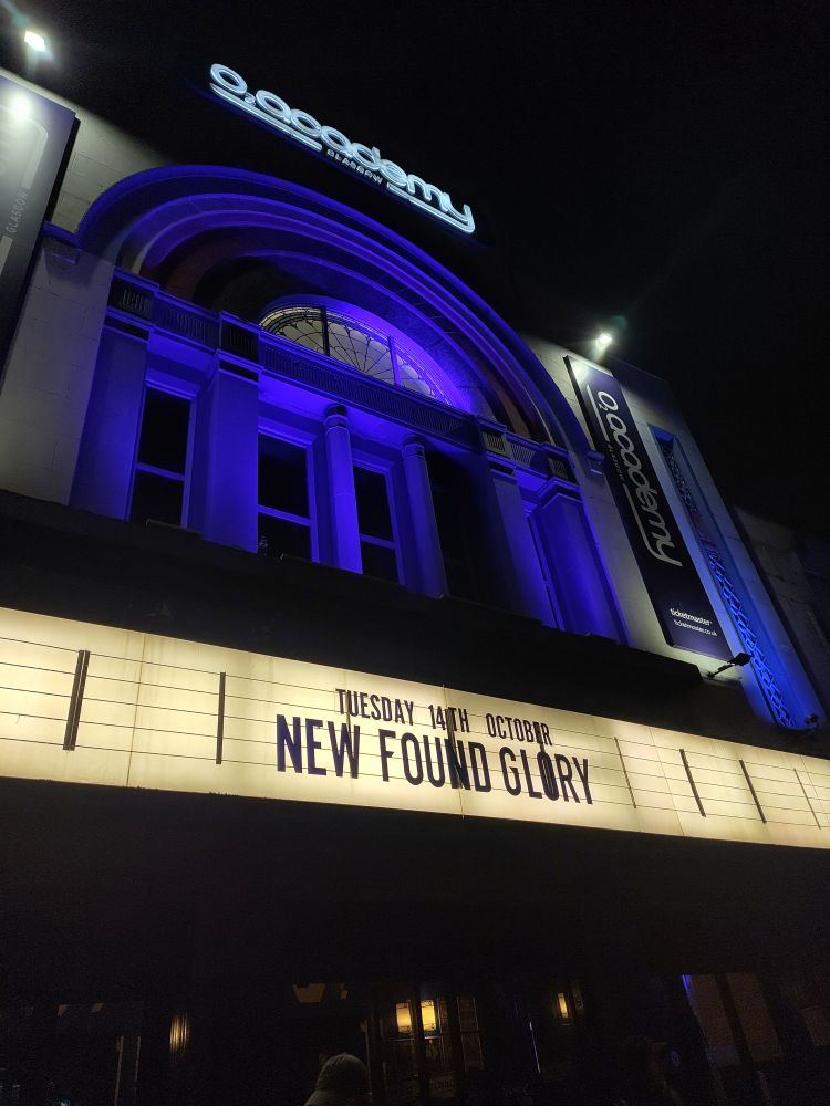 Exterior of the O2 Academy Glasgow with New Found Glory lit up.