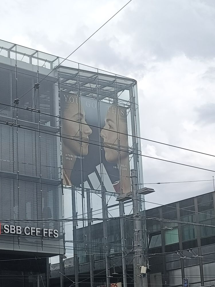 lia wälti and aitana bonmati in an adidas advert on top of bern train station