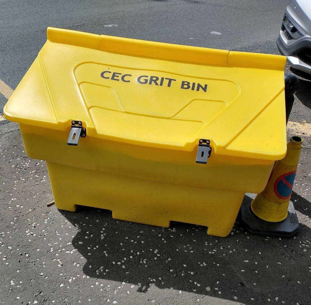 Bright yellow rectangular plastic bin with 'CEC GRIT BIN' in black lettering on the top.