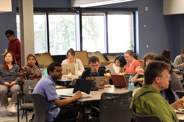 Participants sitting at tables.