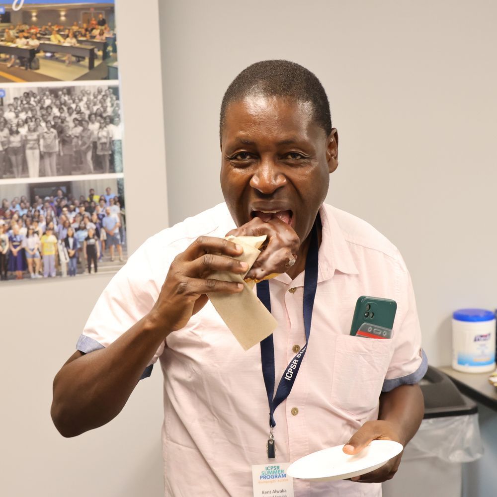 A man biting into a donut